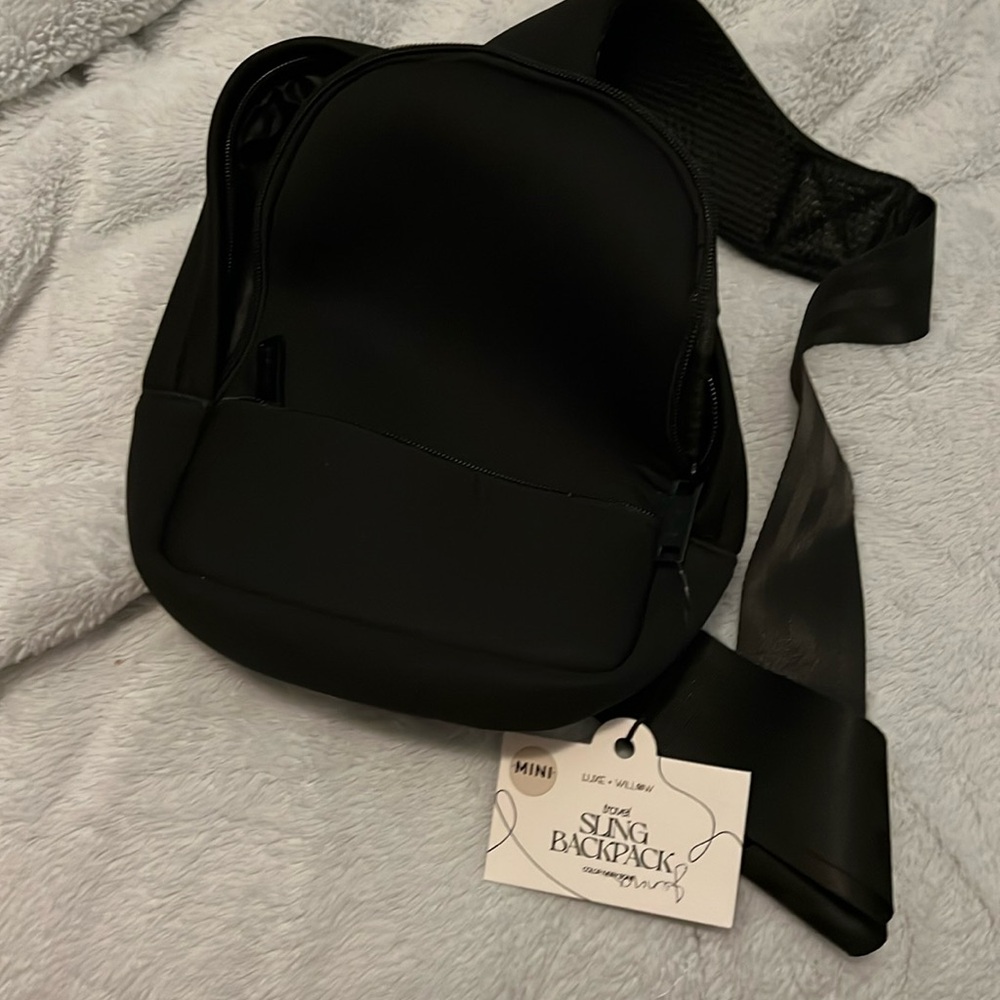 NWT sling backpack